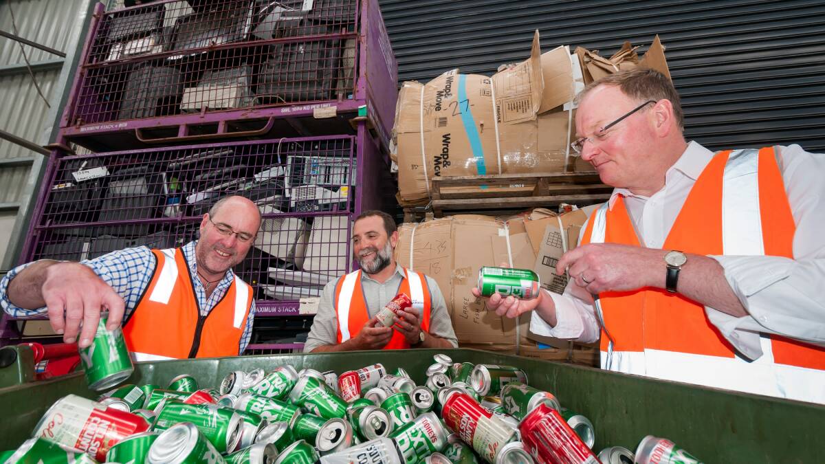 Plan: Peter Freak from Charitable Recycling Australia and Launceston City Council's Mike Attard talk recycling options with Minister Roger Jaensch. Picture: Phillip Biggs.