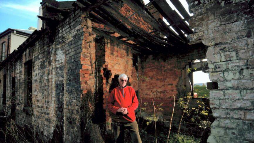 Former owner of the Boland Street Cottages, Michael Newton, at the site. Picture: File 