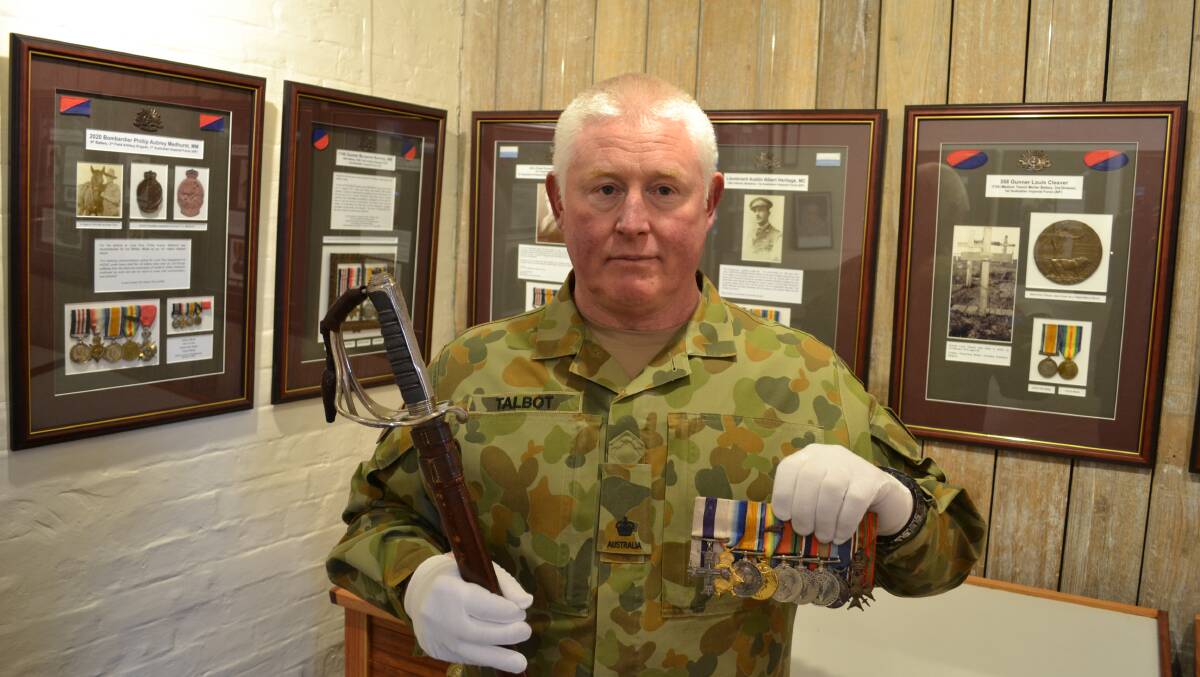 FUTURE: Army Museum of Tasmania manager Major Chris Talbot with medals donated by the Youl family of Leighlands. Picture: Supplied 