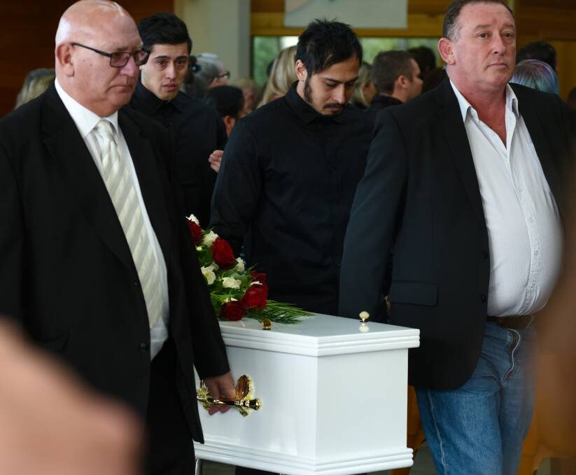 FAREWELL: Pallbearers carry the coffin of Theressa Mae Roberts into the Punchbowl Christian Centre on Tuesday morning. Picture: Neil Richardson 