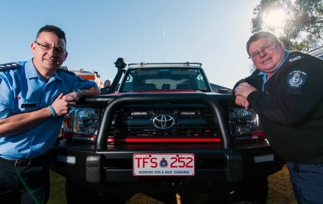BATTLE: Legana Fire Brigade Second Officer Scott Hayes and Chief Michael Clifford with their new vehicle. Picture: Phillip Biggs 