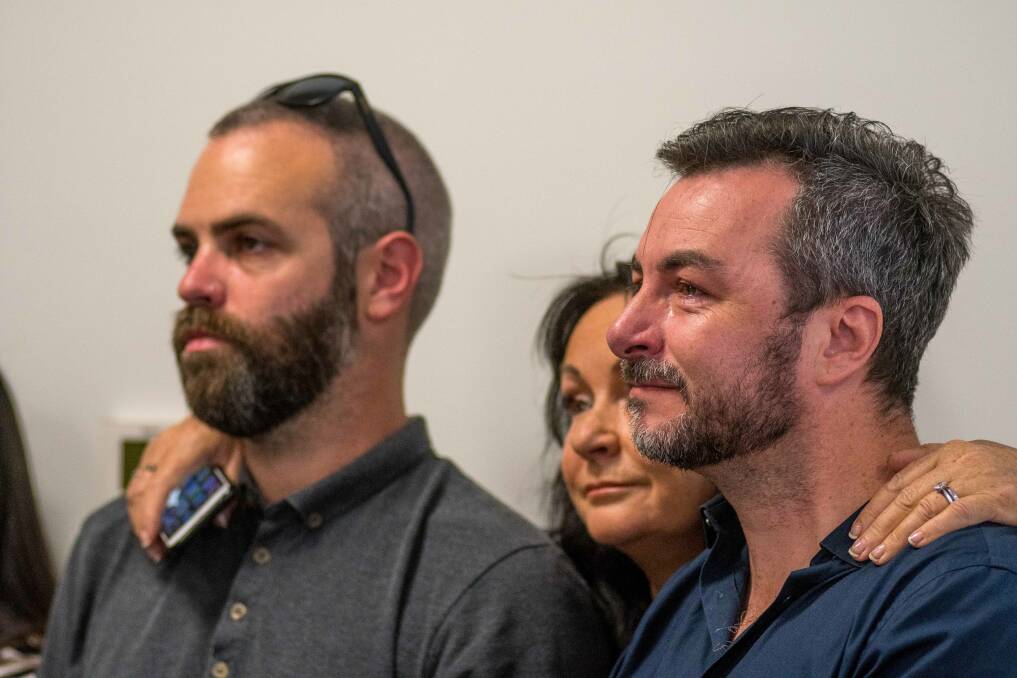 IT'S TIME: David Swan and Rick Marton, a couple for 12 years, watch in Launceston as the same-sex marriage survey 'yes' result is revealed. Pictures: Scott Gelston