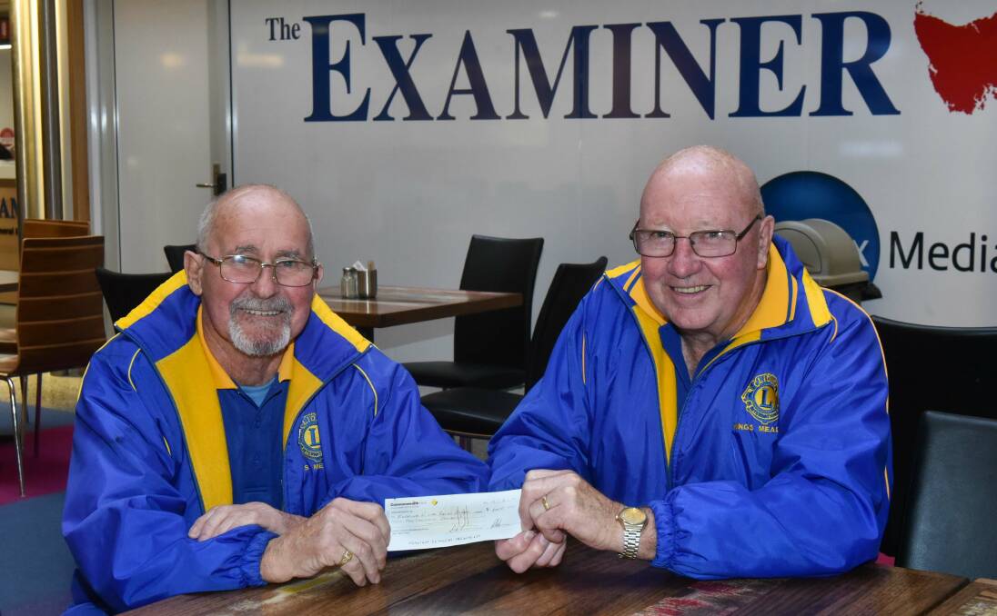 DONATE: Lions Club of Kings Meadows' president Derek Fellows and Colin Hingston give $2000 to the Winter Relief Campaign. Picture: Neil Richardson 