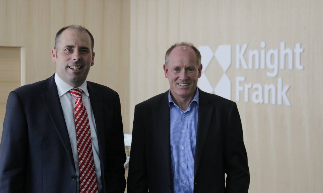 BUILDING BUSINESS: Sam Woolcock and Rob Dixon of the newly merged Knight Frank, now operating out of its new offices. Picture: Matt Dennien