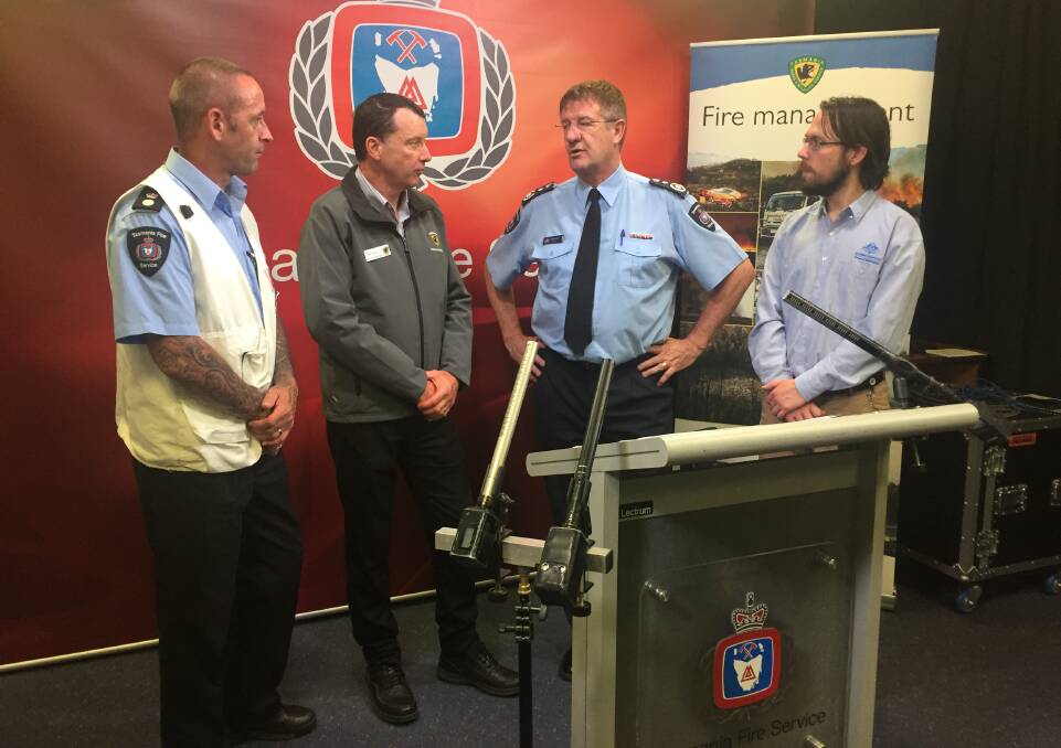 TFS Incident Controller Steve Richardson, PWS Mark Bryce, TFS chief officer Chris Arnol and BOM's Michael Laczko on Thursday afternoon. Picture: Emily Jarvie