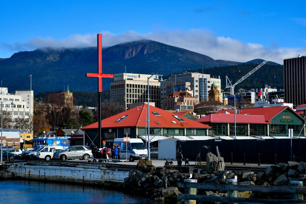 An upside down cross on the Hobart waterfront as part of Dark Mofo. Major Tasmanian festival organisers will meet with the group behind a successful 2018 ACT pill testing trial on Monday. Picture: Scott Gelston