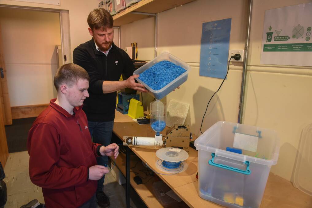 REUSING: Launceston College student Brison Sipthorp, 18, and teacher Kent Poulton turning 3D printer off-cuts into reusable material. Picture: Paul Scambler.