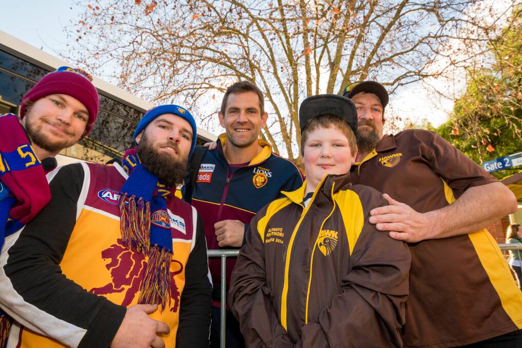 Michael Booth, Scott Lowe, Markus Harris and Kallum Harrison-Lowe pose for a photo with Lions player Luke Hodge. Picture: Phillip Biggs
