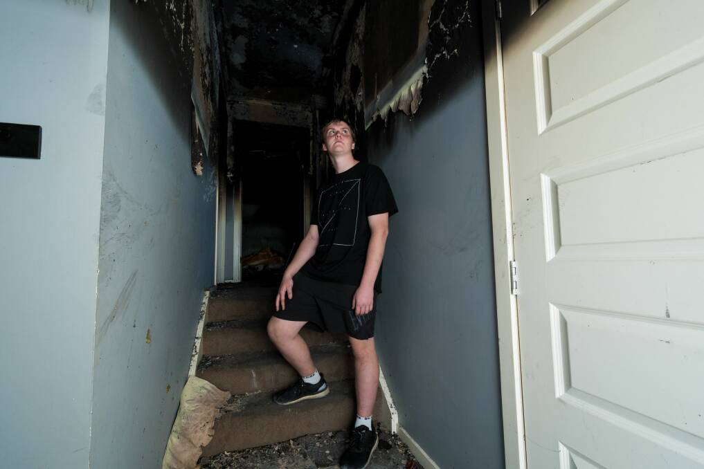 Kaidan Gibson, 16, in his fire-damaged Rocherlea home. Picture: Phillip Biggs
