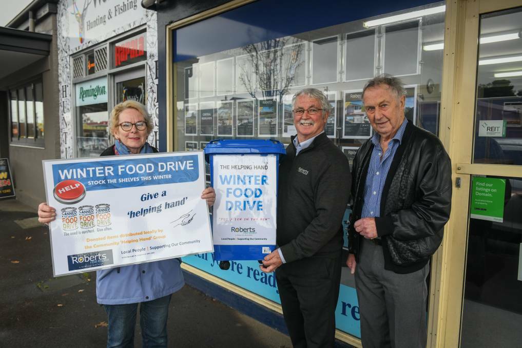 SUPPORT: Barb Baker of Helping Hands and David Headlam of Roberts Real Estate Longford with musician Don Ives. Picture: Paul Scambler