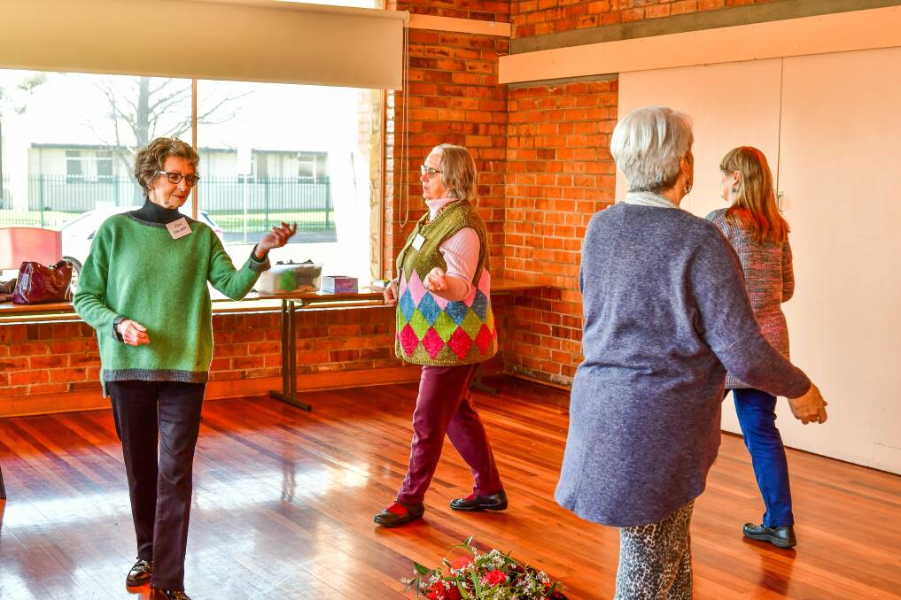 Jen Beavers, Julie Walpole, Karin Le and Jill Di Biagio take part in a circle dance at St Catherines Hall during the Tamar Valley Peace Festival. Picture: Scott Gelston