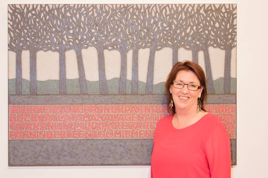 STORYTELLING: Artist Mandy Hunniford with one of her works from 'The Midlands: Whimsy and Pathos' on display at QVMAG. Picture: Supplied