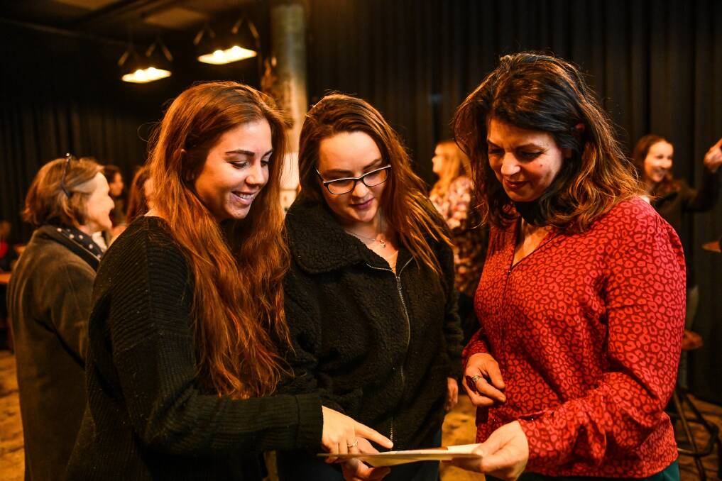 Burger Junkie's Laura Pleasance and Amber Maroney with Swamp Cafe's Kjatrina Steriovich at the Plastic Free July launch event. Picture: Scott Gelston