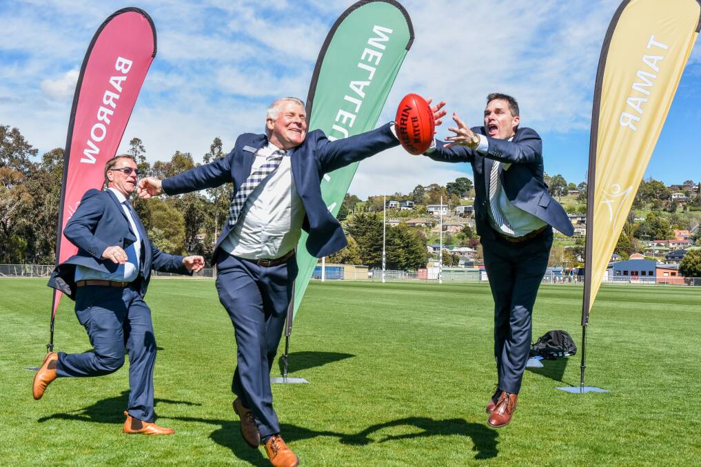 GREAT CATCH: West Tamar Council general manager Rolph Vos, Launceston Christian School principal Adrian Bosker, and LCS business manager Graeme Smith testing out the new school and council oval. Picture Neil Richardson