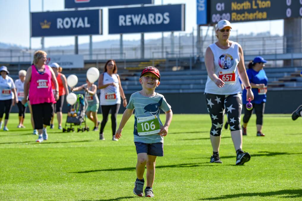 Riley Boutcher competing in the U12 children's 400m Run For A Wish at UTAS Stadium on Saturday. Picture: Paul Scambler.