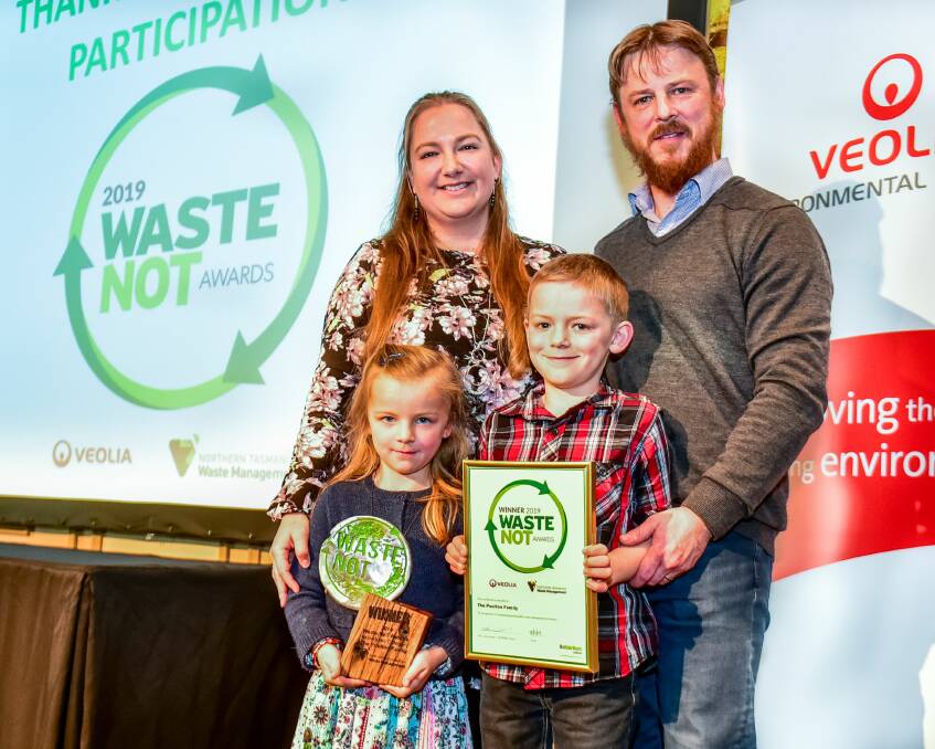 AWARDED: Rebecca and Kent Poulton with Kenzie, 6, and Callen, 8, after taking out the individual and overall categories at the Waste NoT Awards on Wednesday. Picture: Neil Richardson 