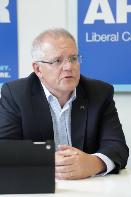 Prime Minister Scott Morrison at the launch of Liberal Bass candidate Bridget Archer's campaign office last month. Picture: Matt Dennien