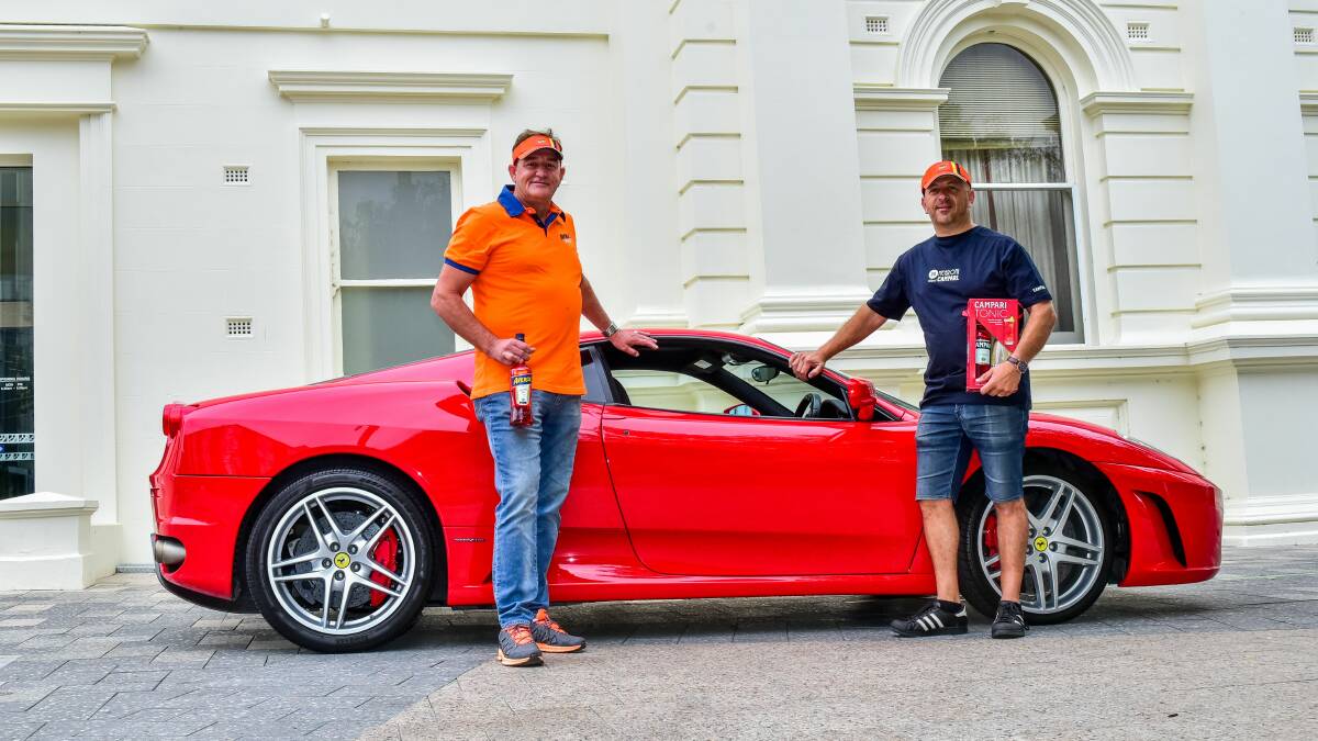 Fiery festival: Mick Acquarola and Marcel Ritchie Little Italy with a Ferrari. Picture: Neil Richardson