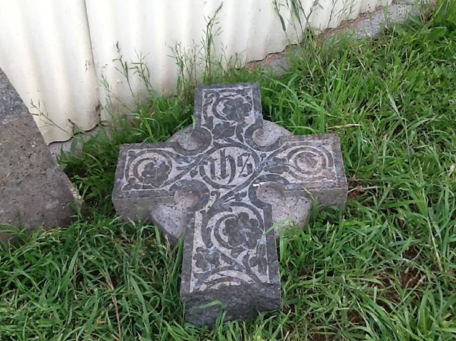 RESTORED: The Celtic Cross which marked the grave of former Evandale School headmaster at the old catholic cemetery. Picture: Supplied