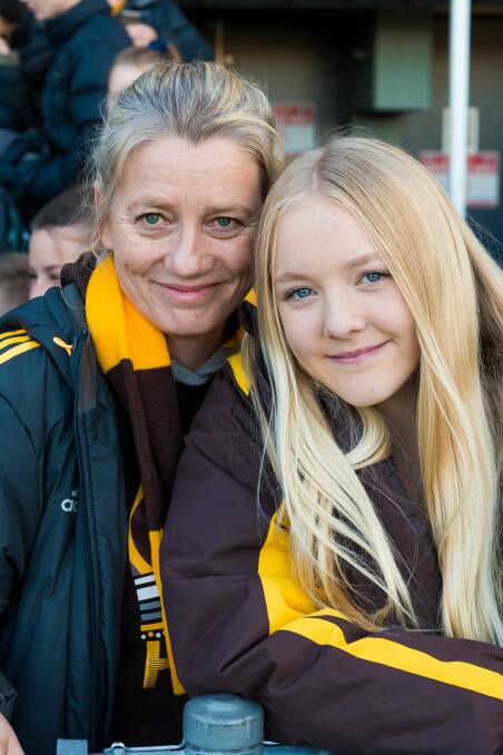 Hawks supporters Simone and Phoebe Xirakis traveled from Canberra to support their team ahead of Phoebe's own games with the under-15s ACT side from Sunday. Picture: Phillip Biggs