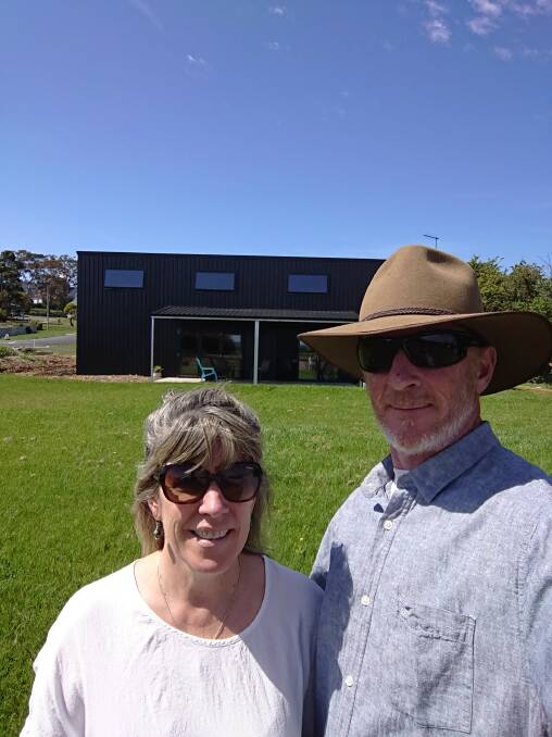 Louise and Darren Elms in front of their 'Bed in a Shed'.
