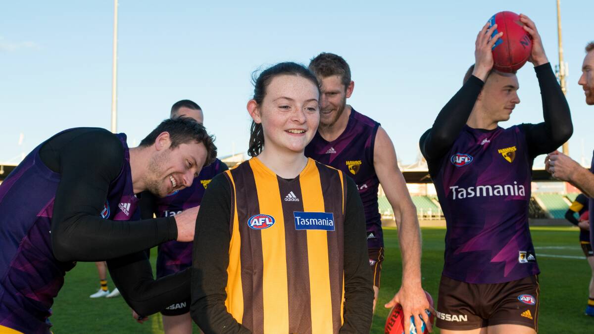 Bella Street had to pinch herself after taking to the field with Hawks players at UTAS Stadium on Friday. Picture: Phillip Biggs
