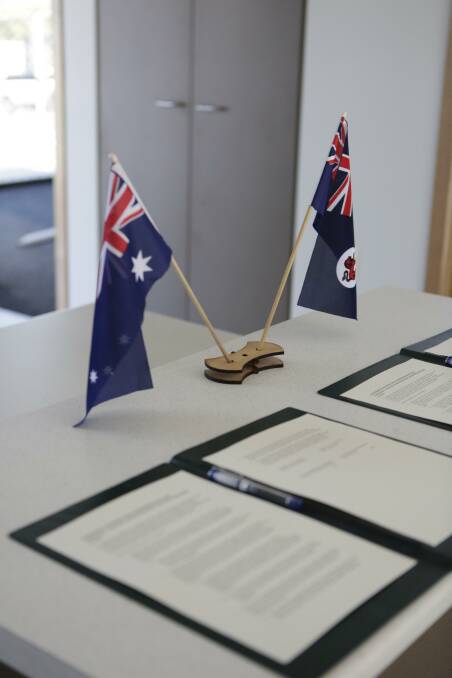The agreement before being signed in a home being constructed under the state government's affordable housing plan in Newnham. 
