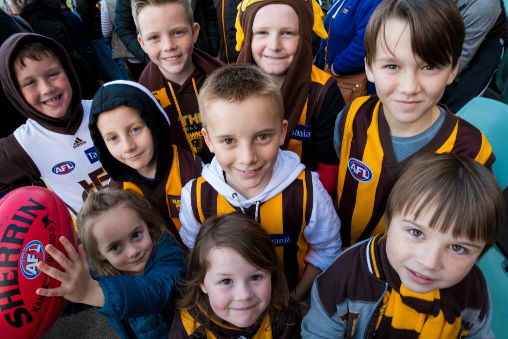Hawks fans Taj Parker, Molly Smith, Isla Parker, Mitchell Smith, Oscar Rankins, Jackson Smith, Jack Bransden, Addison Birrer, and Jakih Curtis turned out to see their team ahead of Saturday's game. Picture: Phillip Biggs 
