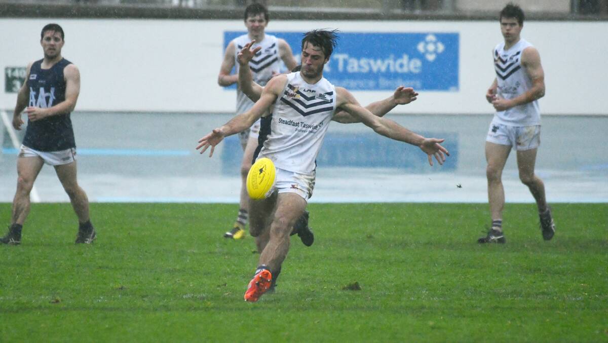 Valued contributor: Burnie's Bailey Boag gets his kick away at the last second during the NWFL match between Burnie and Wynyard. Picture: Brodie Weeding.