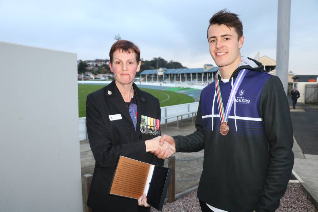 Most courageous and selfless: Burnie Dockers' Bailey Boag congratulated by Burnie RSL president Adele Britton after taking out the Cameron Baird medal. Picture: Supplied.