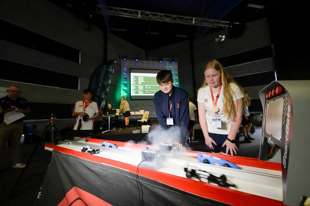 Queechy High School Broken Gearbox team's Hector Russell
and Riverside High School Rapid's Breanna Seen watch their cars at the start of the F1 in Schools competition at Tailracr Centre, Riverside.
Wednesday September 27 2023 Picture by Phillip Biggs