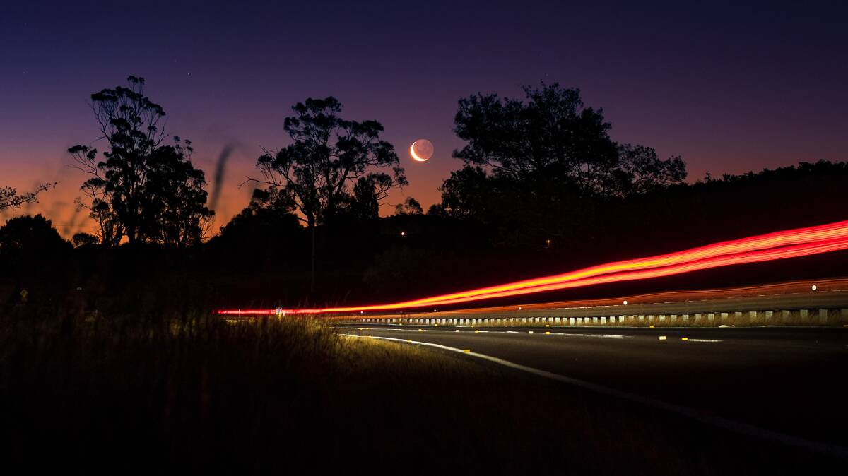 Crescent moon and earthshine over Meander Valley Road near Hadspen, taken during an evening bike ride. February 3 2022 D300S 50mm