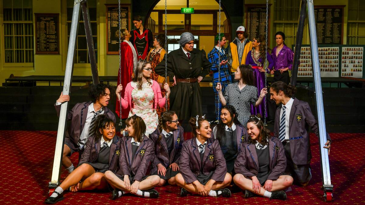 CURIOUS: The Launceston College cast of the 2019 production Matilda, with Elise Kolka as Miss Honey, Lachlan Hindrum as Miss Trunchbull, and Lauren Colson as Matilda. Picture: Scott Gelston