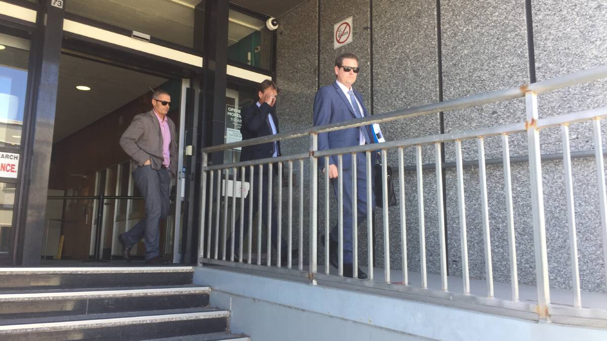 From left: Directors of Forager Foods and defence counsel Nick Terracall leave the Launceston Magistrates Court after the company was fined $40,000.

