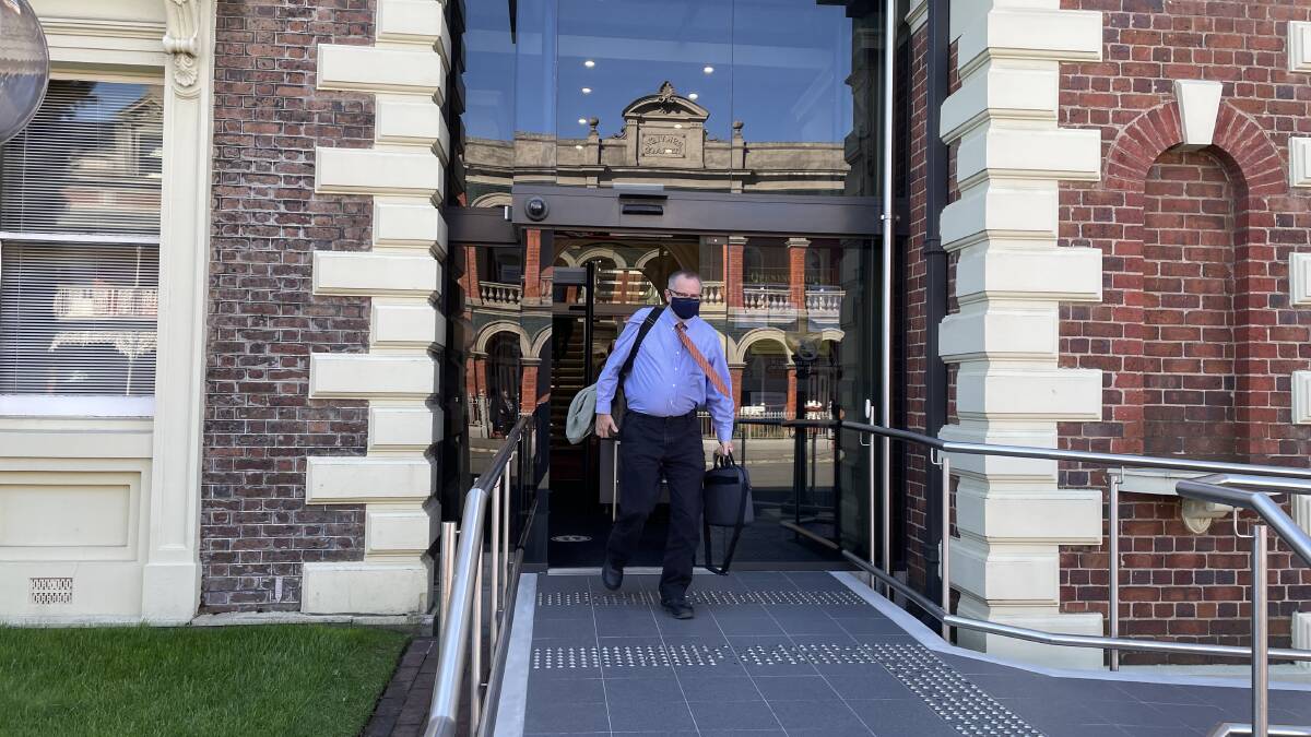 State Forensic Pathologist Donald Ritchey leaves the Supreme Court in Launceston earlier in the trial