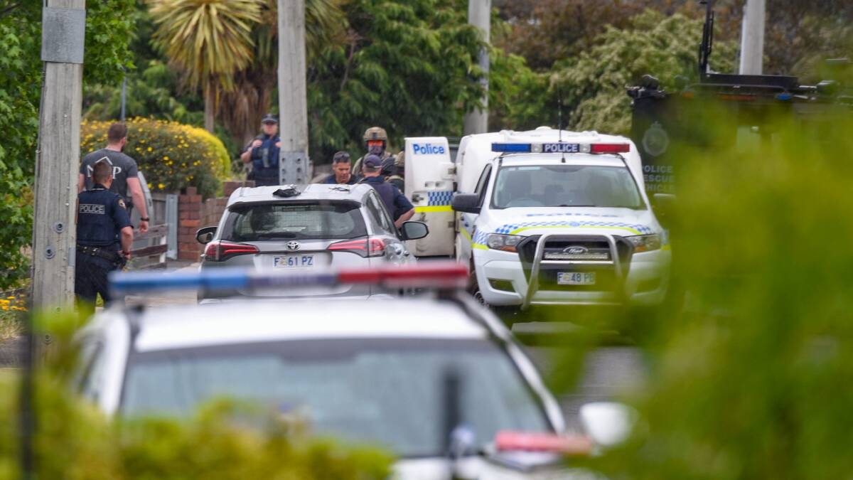 Police load Brett Julian Robinson-Stacey into a paddy waggon after a 17 houyrs siege in New World Avenue Trevallyn in December 2018. The 24-year-old fired 35 shots from a sawn-off .22 rifle at police, cars and a neighbour's roof. 