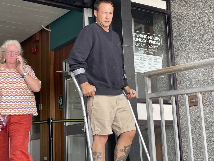 Oliver William Clark leaves Launceston Magistrates Court on crutches on Monday.