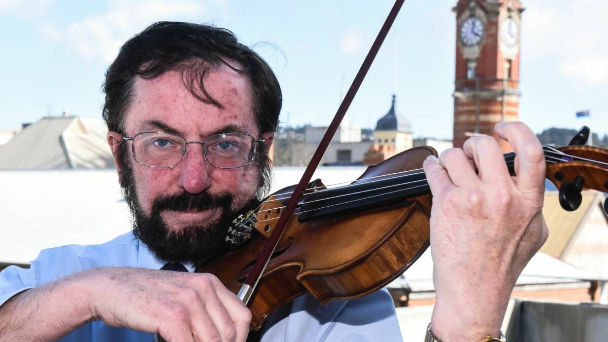 SHARING MUSIC: Kepler Ensemble musical director Wayne Madden, playing his 1928 violin, hopes to make classical music more inclusive for people. Picture: Neil Richardson