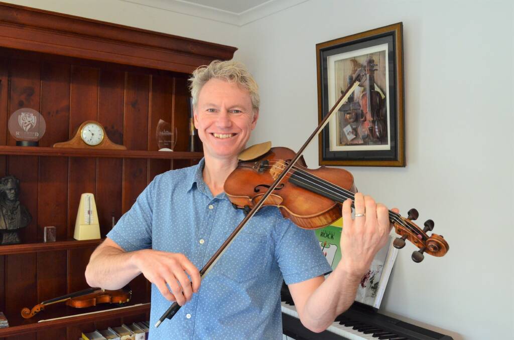 SET ON STRINGS: Michael Stocks has been in the Tasmanian music industry for decades. Picture: Tess Brunton