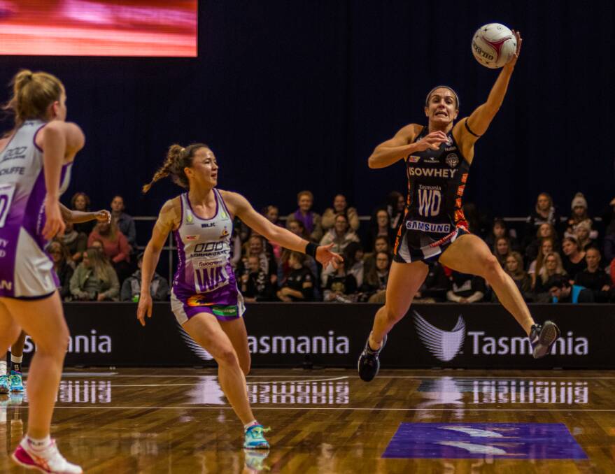 LEAP OF FAITH: Collingwood Magpies defender Ash Brazill makes one of her many intercepts during Sunday's Super Netball contest in Launceston against Queensland Firebirds. Pictures: Phillip Biggs