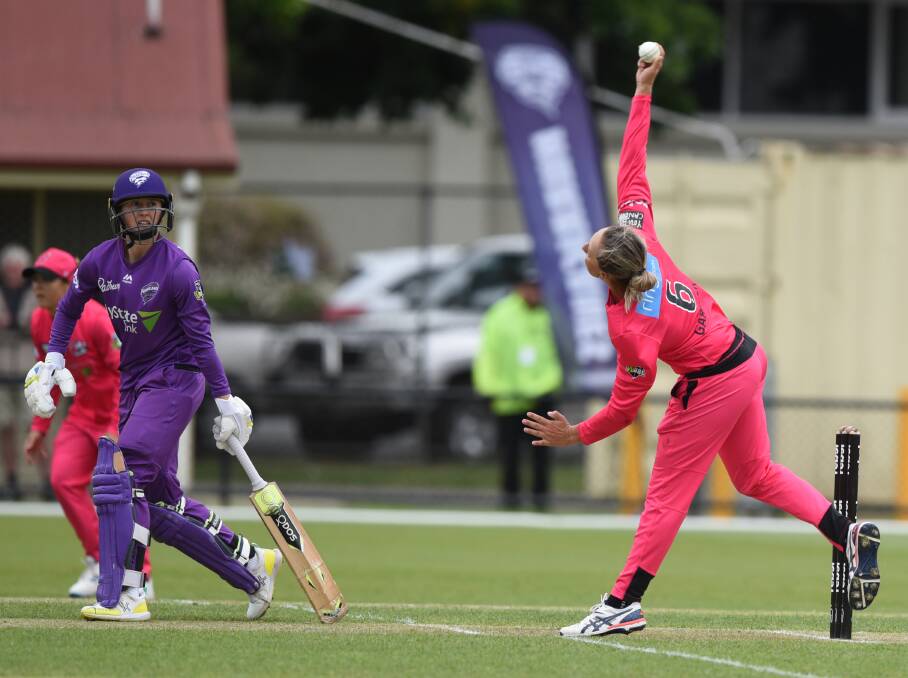 FULL STRETCH: Sixers offspinner Ashleigh Gardner looks to impart revs on the ball.