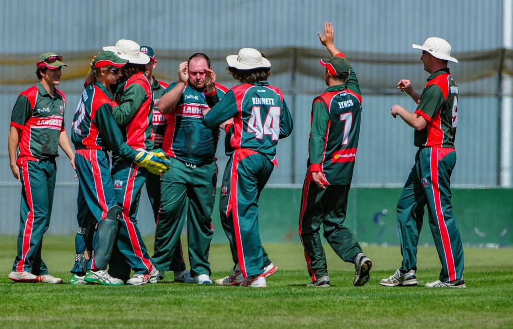 STILL HERE: Launceston, who celebrate one of their wickets on Saturday, are still going strong. Picture: Paul Scambler