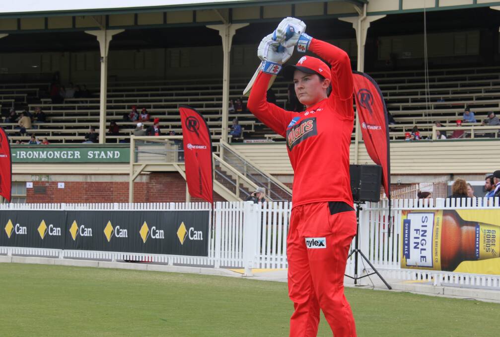 STANCE: Courtney Webb practices her shots in rival colours during last weekend's pre-game warmup against Hobart Hurricanes.