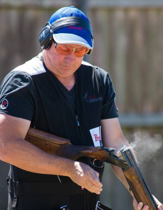 SMOKING: Tim Steer takes a breather between smouldering shots during the state double rise championship on Friday at the Tasmanian Gun Club. Picture: Phillips Biggs 