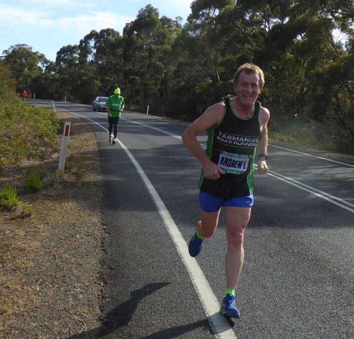 PRESSING ON: Tasmanian road runner icon Andrew Law hits the bitumen ahead of a wait on the New York City Marathon's viability. Picture: Supplied