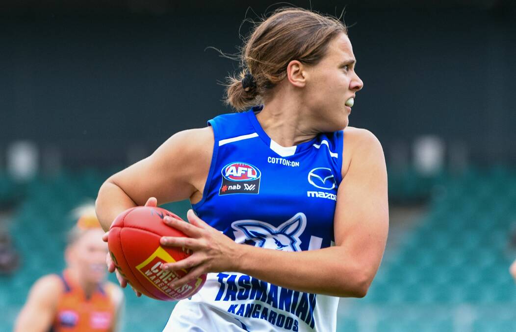 ON THE MOVE: Kangaroos star Jasmine Garner looks to race away in the midfield from all Giants opponents. 
