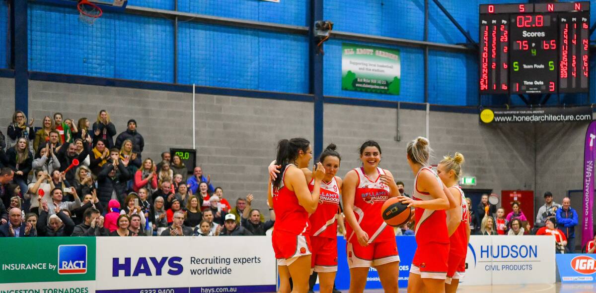 ECSTATIC: Tornadoes players celebrate the win during the final seconds of the SEABL preliminary final. Picture: Scott Gelston