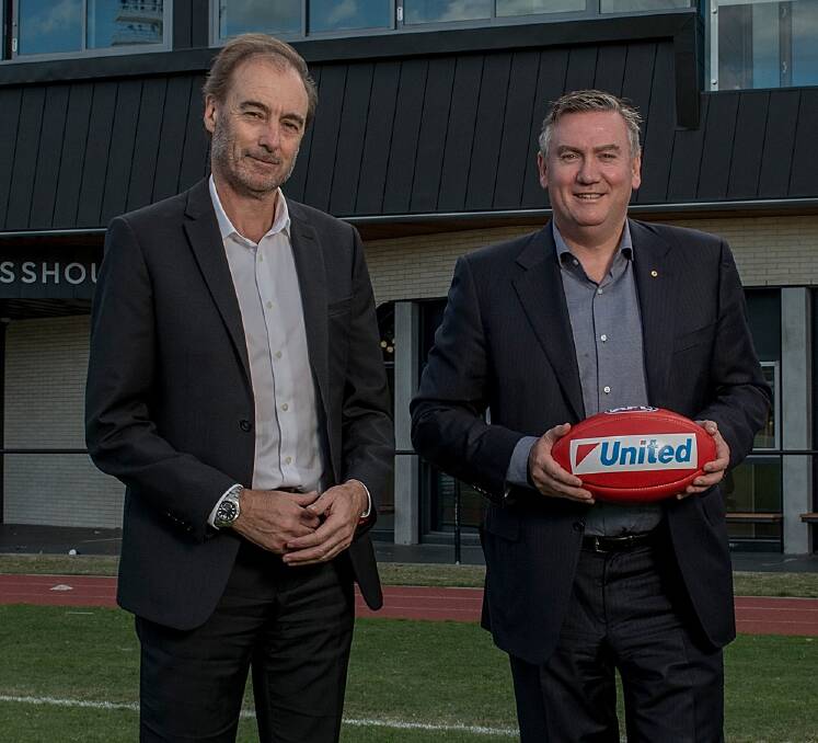 GOOD COMPANY: David Emerson, who is negotiating Collingwood's deal with Netball Tasmania, with club president Eddie McGuire. Picture: Fairfax Media