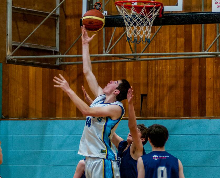 NICE MOVE: Kingborough-Huon's Nathan O'Meara shapes to go on the inside of the basket against Wynyard.