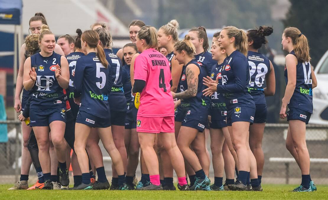 FIRED UP: Launceston AFLW star Daria Bannister pumps up the Blues before last week's TSLW clash against North Launceston in the season opener. Picture: Neil Richardson